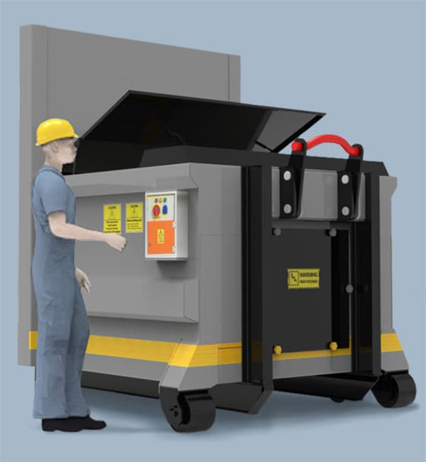 Downwaste DWPC press compactor — operator loading waste into the charge box