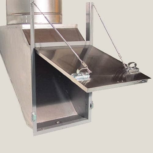 Fire-rated laundry discharge door at base of chute